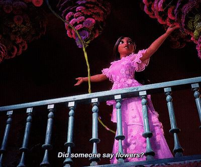 Woman In Purple Dress Holding Flowers Saying Did Someone Say Flowers GIF