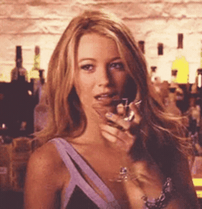 Woman In Purple Dress Holding Wine Glass GIF