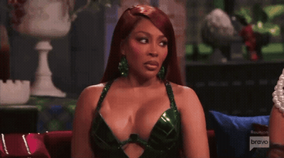 Woman In Purple Dress In Front Of Fireplace Real Housewives GIF