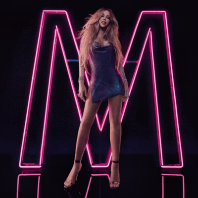 Woman In Purple Dress In Front Of Neon Letter M GIF
