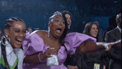 Woman In Purple Dress Laughing With Mouth Open GIF