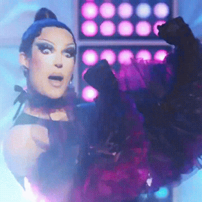 Woman In Purple Dress Making Funny Face GIF