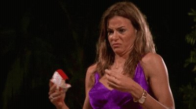 Woman In Purple Dress Making Funny Face Holding Paper GIF