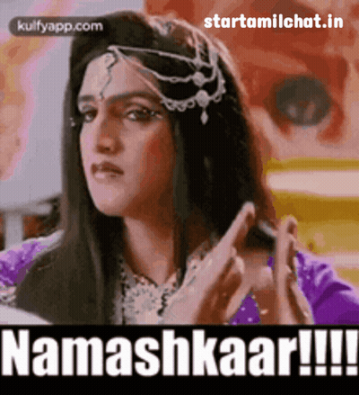 Woman in Purple Dress Saying Namashkaar