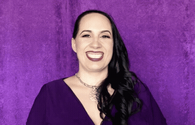 Woman In Purple Dress Smiling GIF