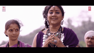 Woman In Purple Dress With 4L Sign GIF