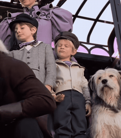 Woman In Purple Dress With Two Boys And White Dog GIF