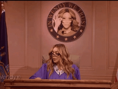 Woman In Purple Gown At Podium With Wendy We Trust Seal GIF
