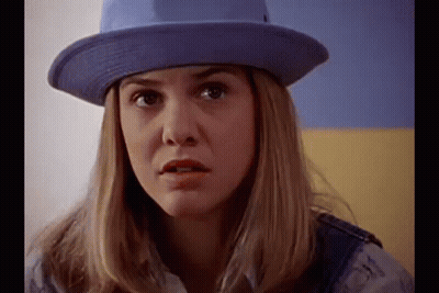 Woman In Purple Hat And Overalls GIF
