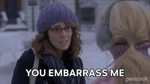 Woman In Purple Hat And Scarf Saying You Embarrass Me GIF