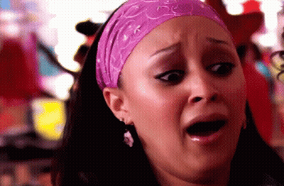 Woman In Purple Headband Making A Face GIF