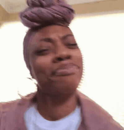 Woman In Purple Headband Making Funny Face GIF