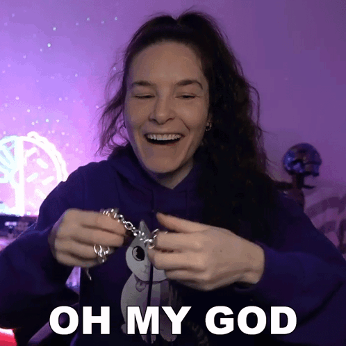 Woman In Purple Hoodie Holding Necklace Oh My God GIF