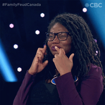 Woman In Purple Jacket Making Gesture GIF