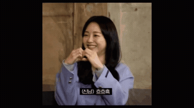 Woman In Purple Jacket Making Heart With Hands GIF