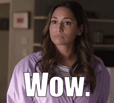 Woman In Purple Jacket Saying Wow GIF
