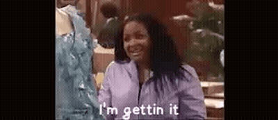 Woman In Purple Jacket Smiling Saying I'm Gettin' It GIF
