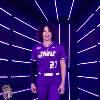 Woman In Purple JMU Softball Jersey Smiling GIF