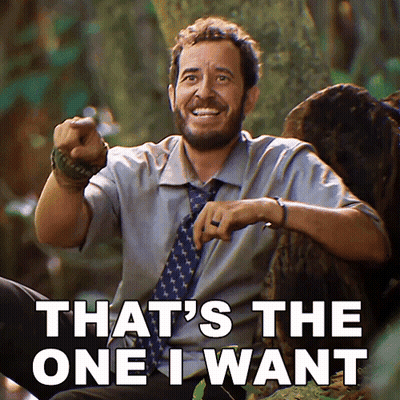 Woman In Purple Jumpsuit Dancing On Stage While Man Takes Picture GIF