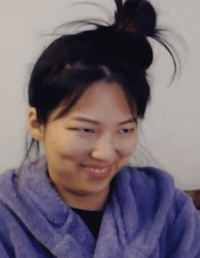 Woman In Purple Robe And Messy Bun GIF