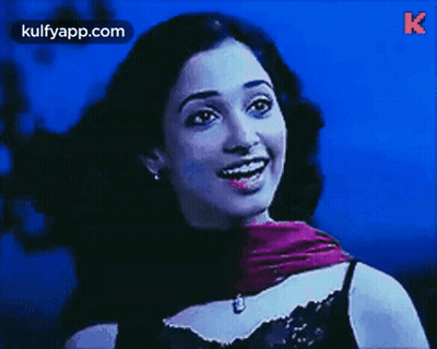 Woman In Purple Scarf Blue Background GIF