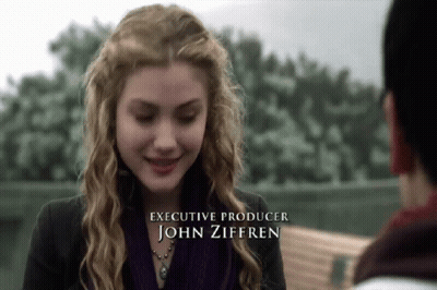 Woman In Purple Scarf Smiling Executive Producer John Zifferen GIF