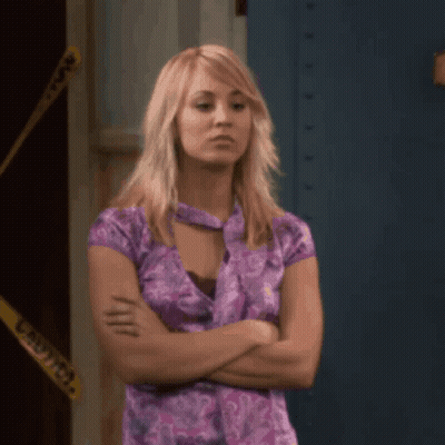 Woman In Purple Shirt Arms Crossed By Caution Tape GIF