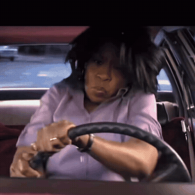 Woman In Purple Shirt Driving Car GIF