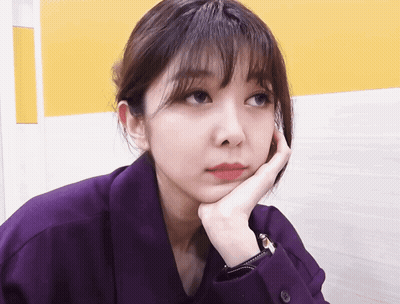 Woman In Purple Shirt Hand On Face GIF