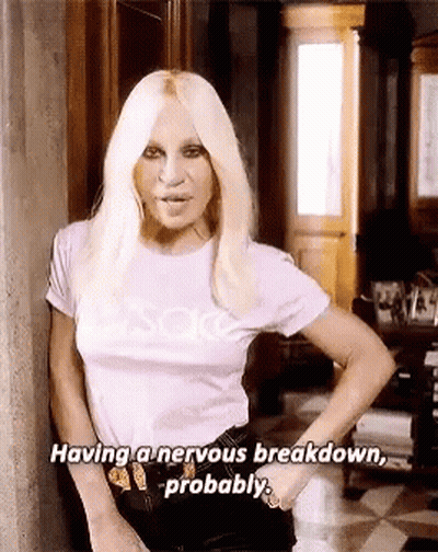 Woman In Purple Shirt Having Nervous Breakdown GIF