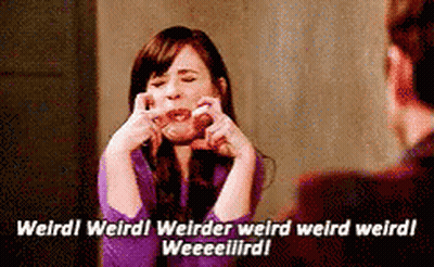 Woman In Purple Shirt Making Face Talking To Man In Suit GIF