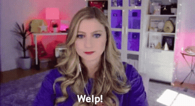 Woman In Purple Shirt On Video Call With Headphones GIF