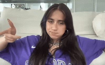 Woman In Purple Shirt Pointing At Camera GIF