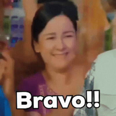Woman In Purple Shirt Saying Bravo GIF