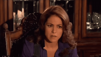 Woman In Purple Shirt Sitting In Chair GIF