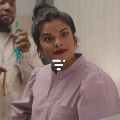 Woman In Purple Shirt Smiling With Man Holding Blue Ribbon GIF