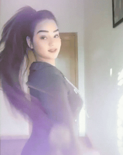 Woman In Purple Shirt Standing GIF