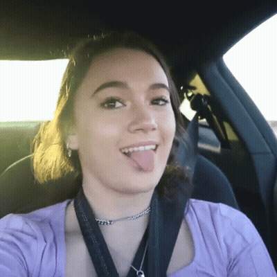 Woman In Purple Shirt Sticking Out Tongue GIF