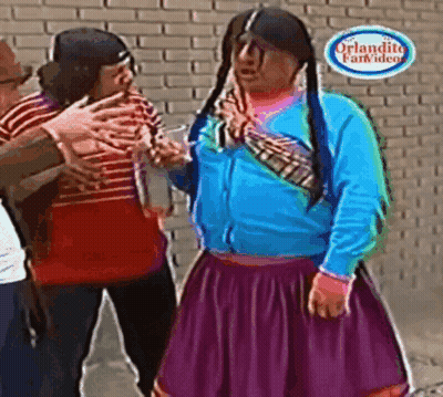 Woman In Purple Skirt Standing In Front Of Brick Wall GIF