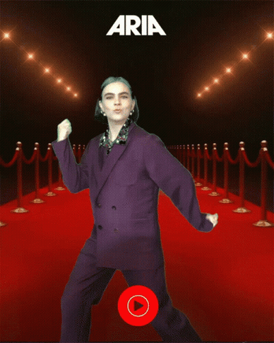 Woman In Purple Suit Dancing On Red Carpet With Aria GIF
