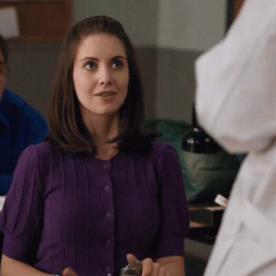 Woman In Purple Sweater Looking GIF