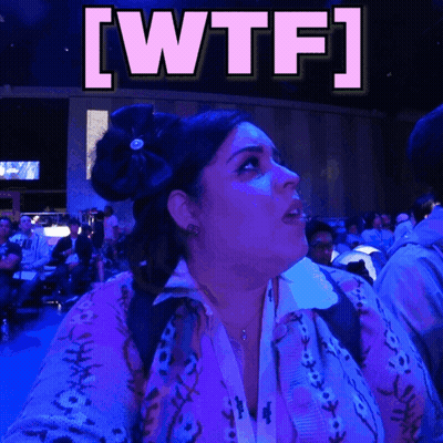 Woman In Purple Sweater Looking Up At WTF GIF