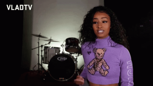 Woman In Purple Sweater With Teddy Bear GIF