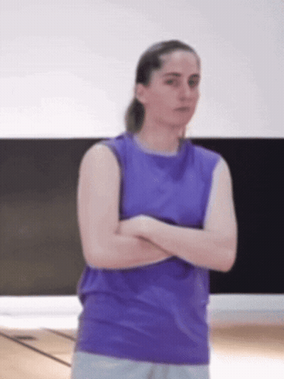 Woman In Purple Tank Top Arms Crossed In Gym GIF