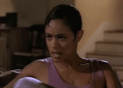 Woman In Purple Tank Top Making Face GIF