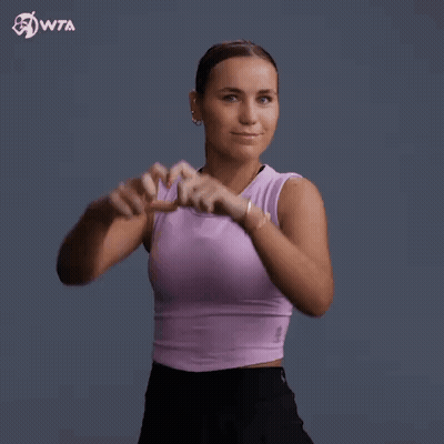 Woman In Purple Tank Top Making Heart Shape GIF