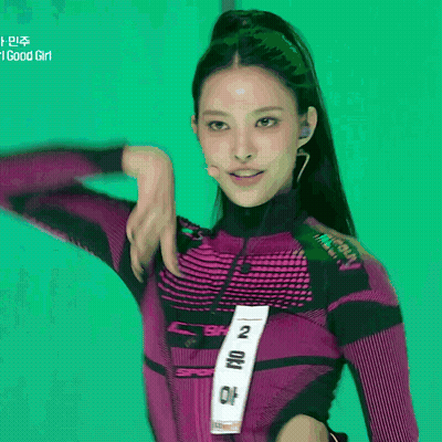 Woman In Purple Top With Number 2 GIF