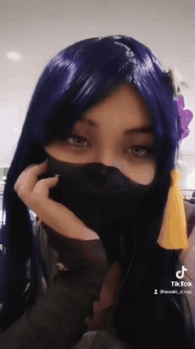 Woman In Purple Wig And Black Mask GIF