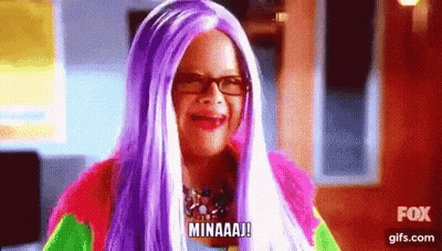 Woman In Purple Wig And Glasses Making Funny Face Saying Minaaj GIF