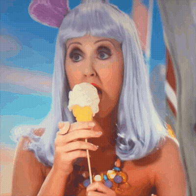 Woman In Purple Wig Eating Ice Cream GIF
